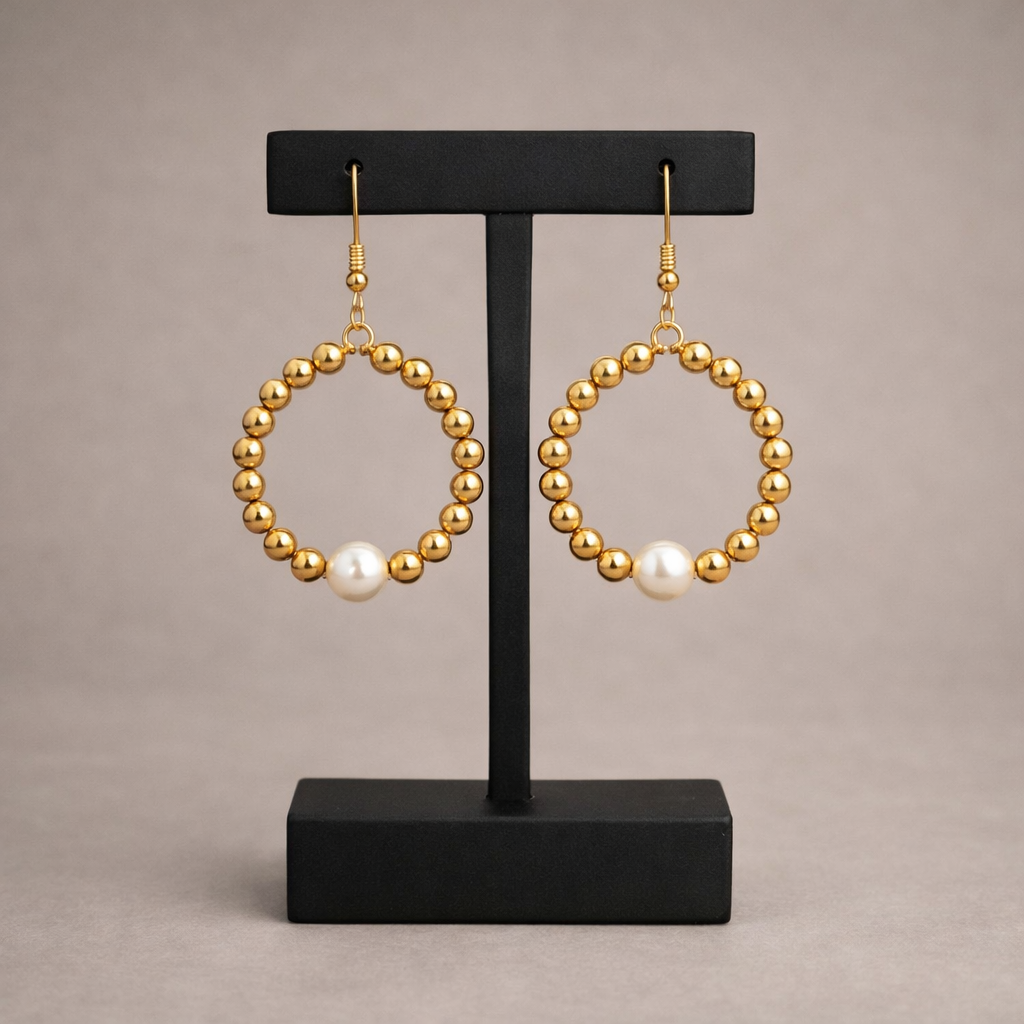 Gouden ronde oorbellen met glasparels