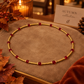 Ketting met Rode Crystalkralen en Goudkleurige Rocailles